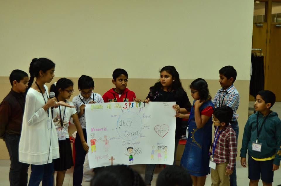 Children presenting a Fruits of the Spirit poster